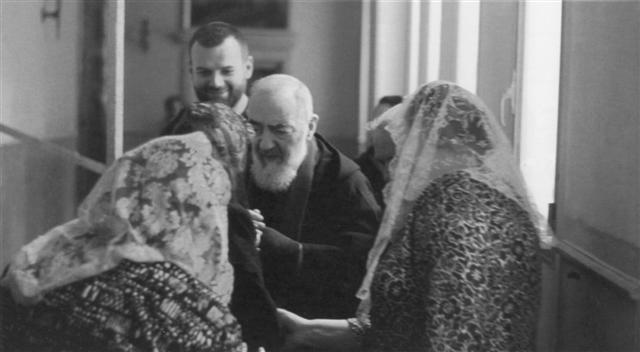 Padre Pio greeting people